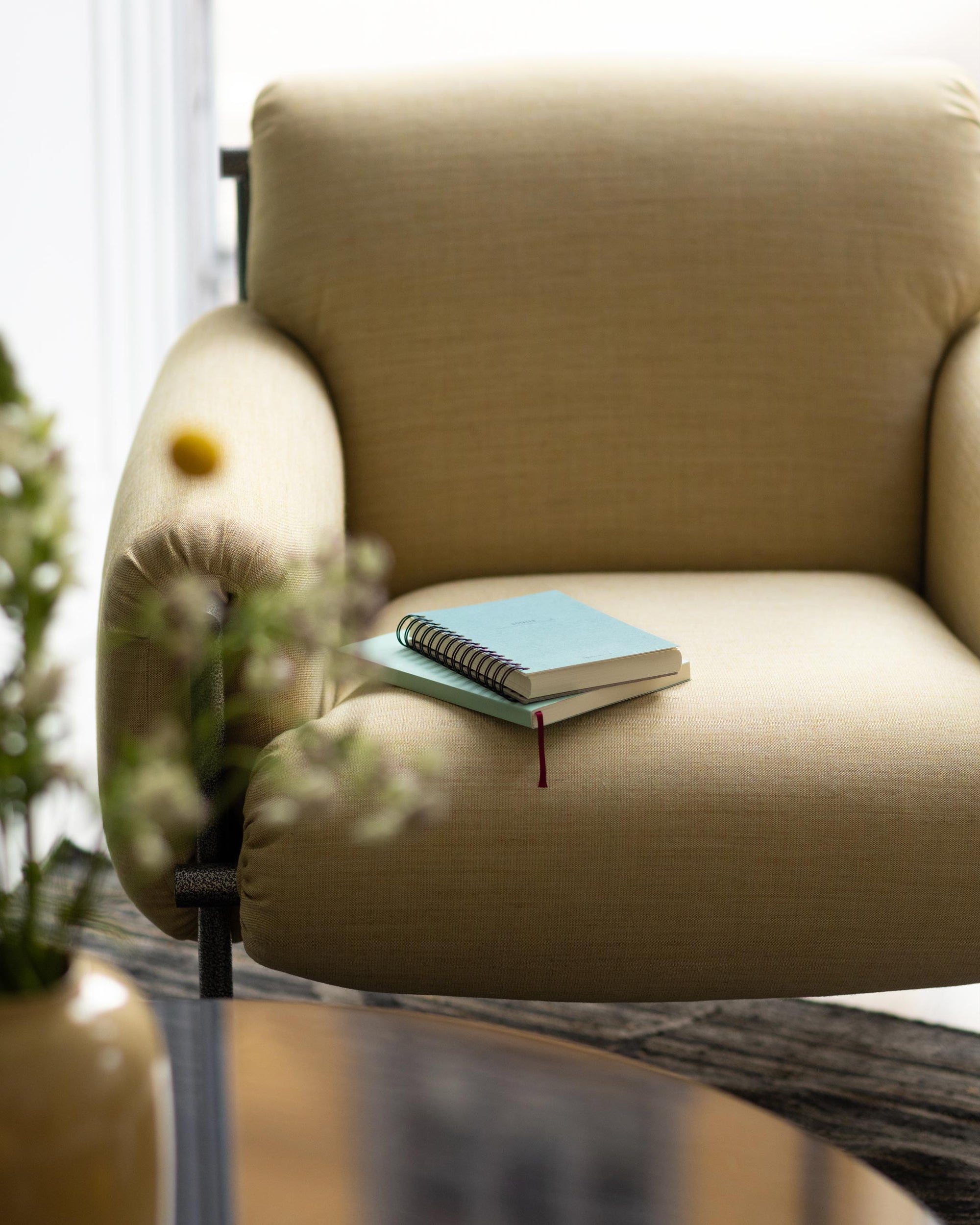Comfortable chaire with a small stack of notebooks